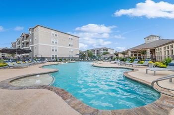 Resort-inspired swimming pool with tanning deck